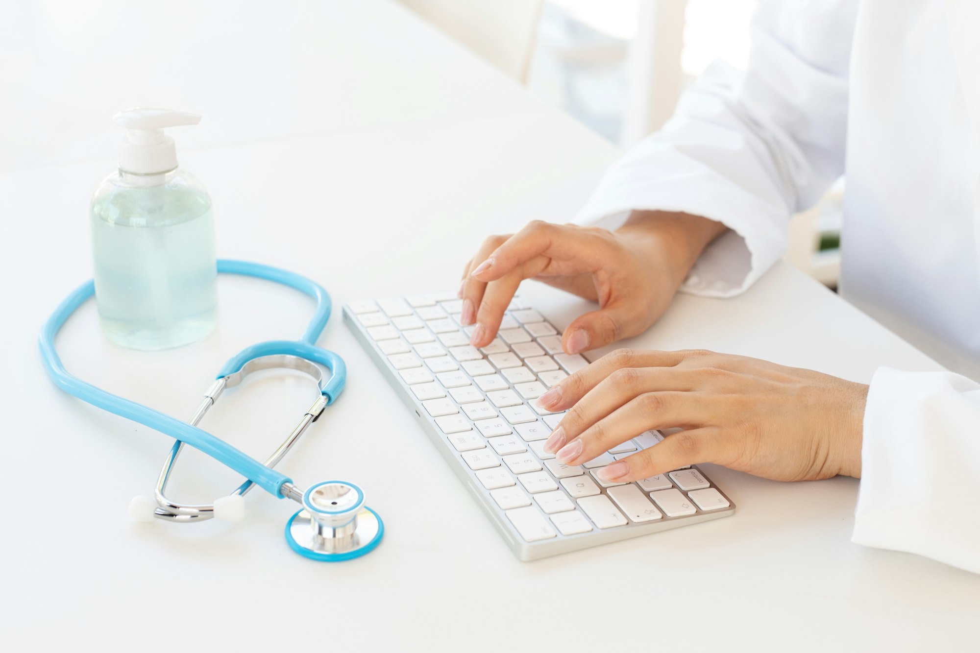 woman physician using computer in clinic studio